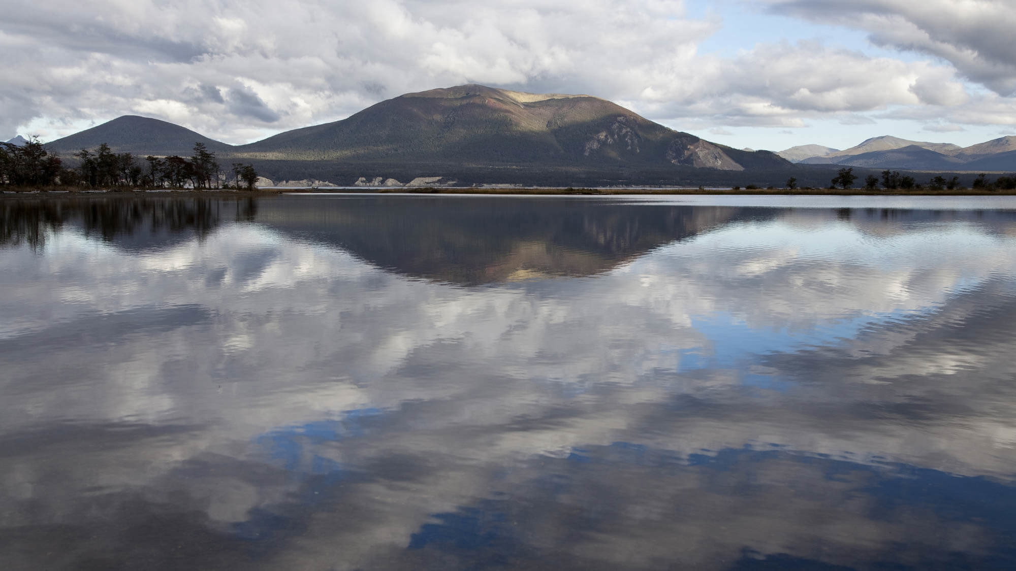 Reflection of the mountains on Lake Fagnano in Ushuaia