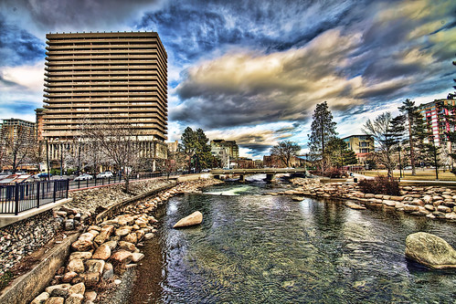 horizontal river day daylight outdoors outside hdr photomatix highdynamicrange buildings structures clouds truckeeriver reno nv nevada trees wingfieldpark fencing retainingwalls reflections boulders stones skyscraper condos
