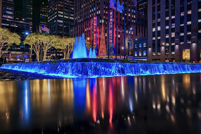 Fountain and reflection in front of Radio City Music Hall at night