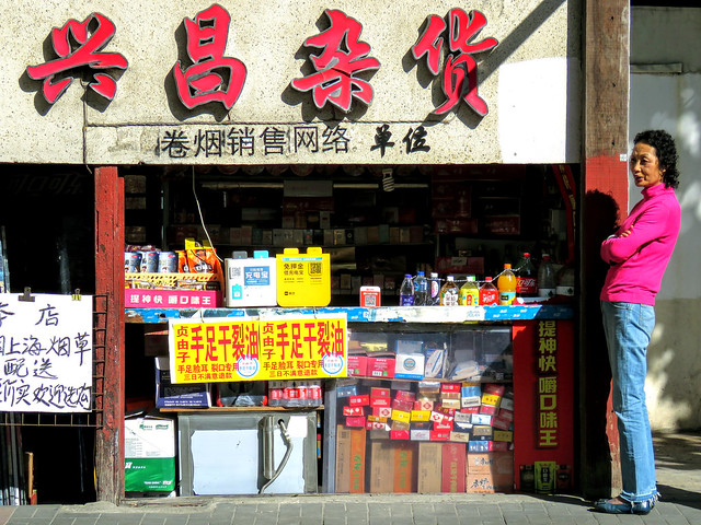 Woman grocer and her shop