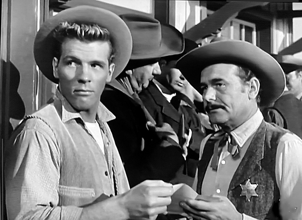 Actor/ physique model Robert Hover is seen here with actor/ songwriter Stan Jones in “The Last Train West,” an episode of “Cheyenne” from 5/29/1956.