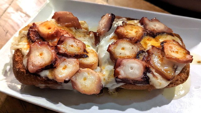 Cheesy octopus toast at Alimentacion Quiroga in Madrid in Madrid, Spain 