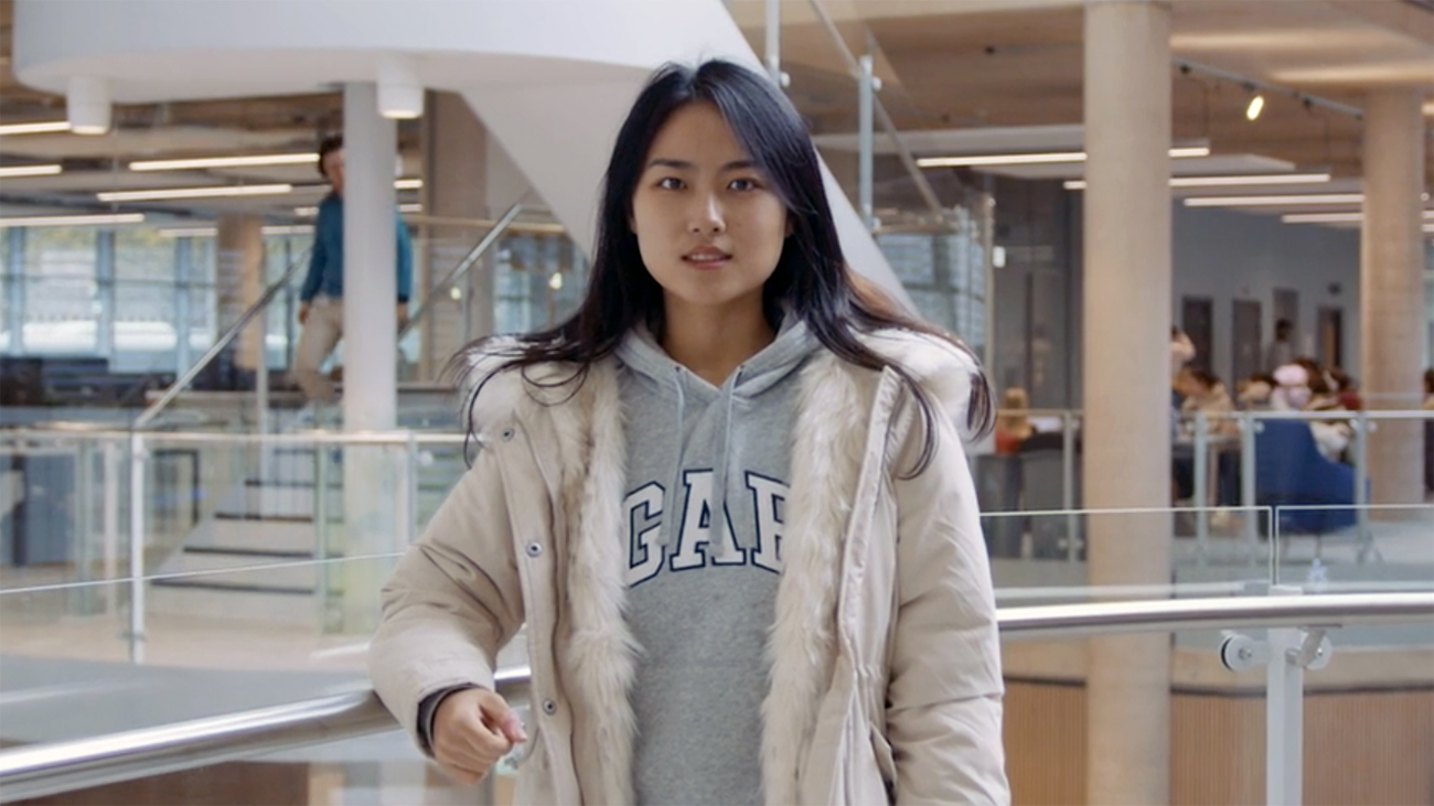 Yuyang stood in a foyer in a building at the University of Bath.
