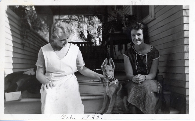 Photo of Mrs Arvid Pihlblad and Daughter, Lila Sitting on the Steps of the House with their Dog