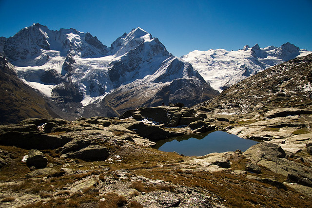 Piz Bernina (4048 m), Piz Roseg (3937 m) and the Sella group seen from high above Val Roseg
