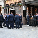 London Pub with men in suits having drinks