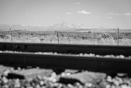 Old School by Brett Kberg, The Yellowstone line South of Ashton, ID offers a distant view of the Tetons. Ive often wondered the
