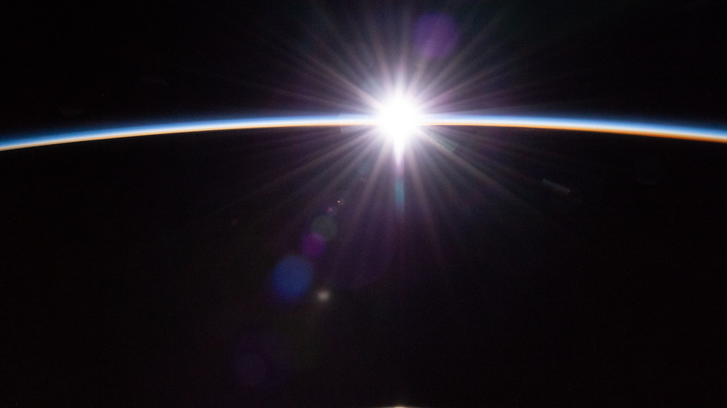 The sun's first rays burst through the Earth's atmosphere | Flickr