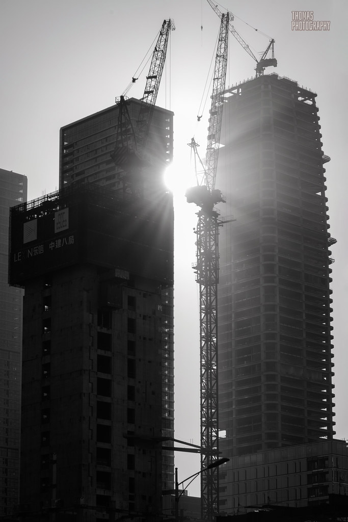 Sunlight shines through buildings under construction