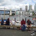old folks enjoying the view of Granville Island in Vancouver, Canada 