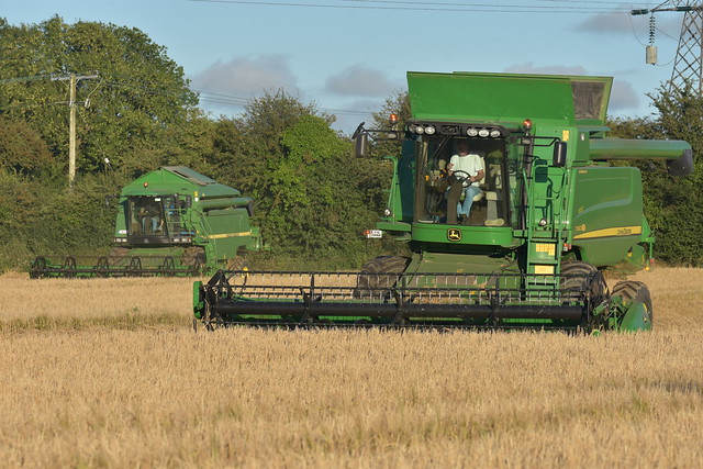 John Deere T560 Hill Master and 2258 Combine Harvesters cutting Spring Barley