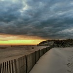 27. November 2023 - 16:40 - Moody, ominous sky for moody, ominous times.

3 minutes after the sun dipped below the horizon (sunset 4:27 PM) on the west end of Fire Island, New York. (Field 2) -- November 27, 2023 