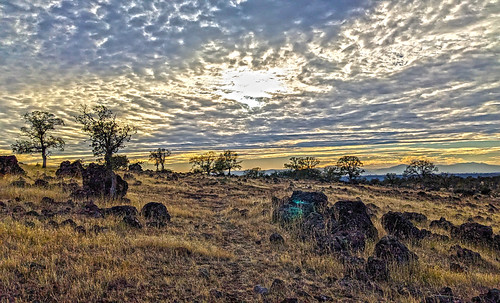 Sun Behind the Clouds by jhhwild, Another picture taken while out on a hike.sun behind clouds sunset rocky landscape