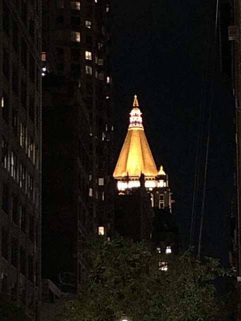 Spire of New York Life Building at night from W. 26th Street, New York City