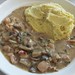Chicken fricassee with spicy curry mashed potates