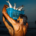 Fisherman unloading fishes