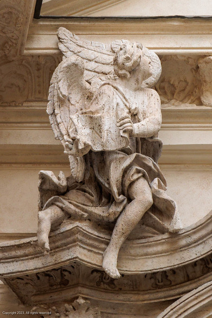 Left angel above the door at the Church of Santa Maria Maddalena