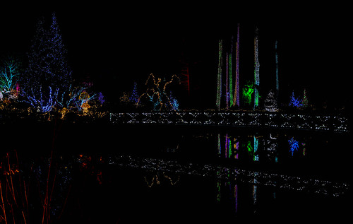 Holiday Glow This is sort of the opposite of the last photo being taken from the opposite shore of this pond.  The large troll, Roskva, is visible between the lighted trees.