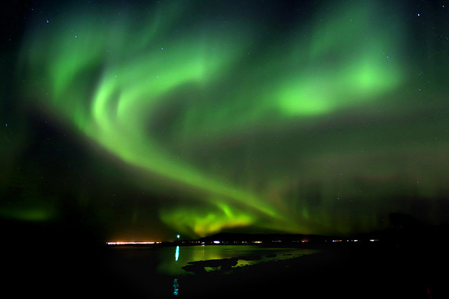 Blazing northern lights show at the sea shore, Iceland