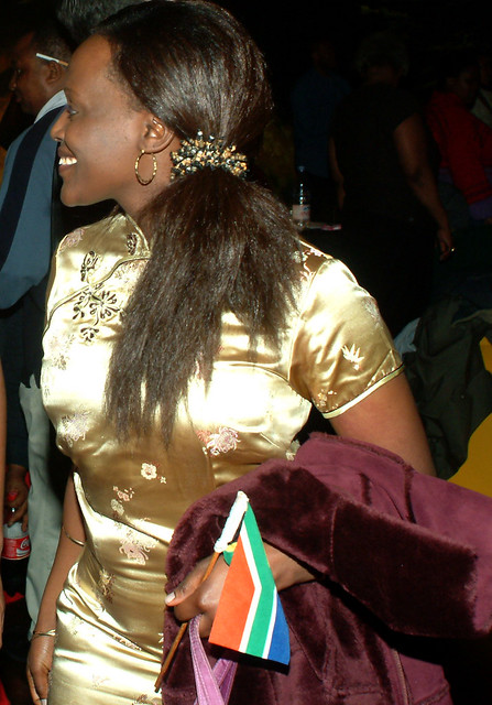 DSCF0419v The Republic of South Africa 8th Freedom Day Celebration April 2002 by the SAHC South African High Commission UK at Camden Town Hall Kings Cross London. SA Lady in Yellow Chinese Mandarin Cheongsam Gown