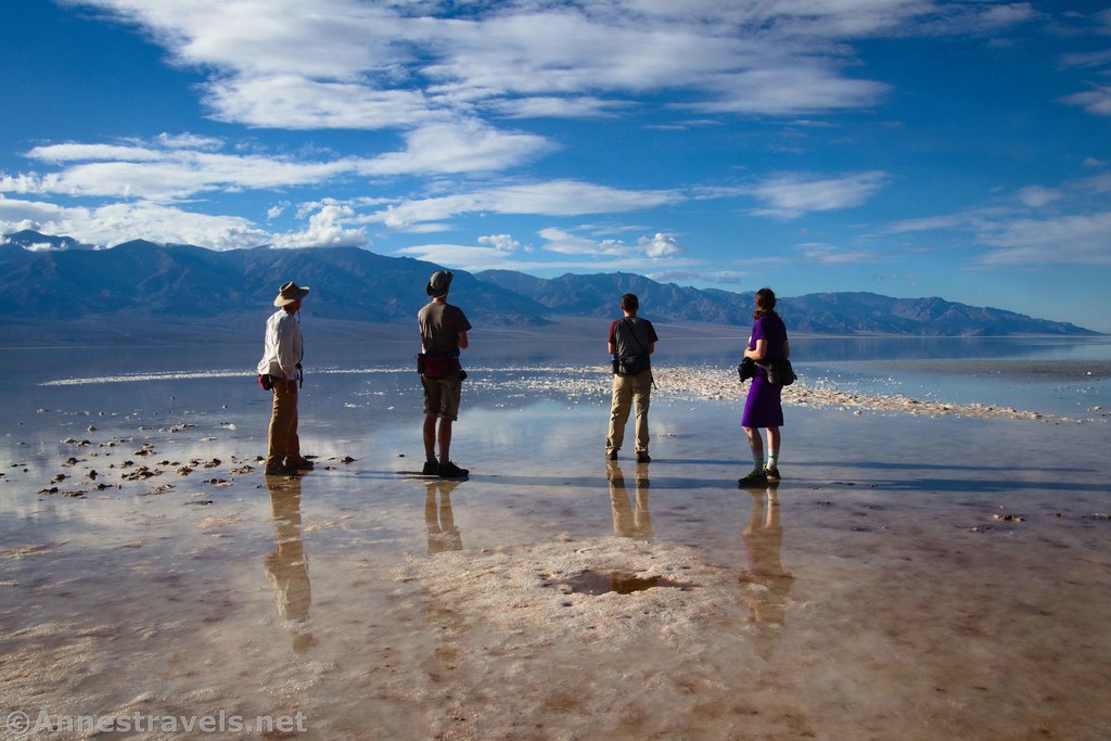 By taking the photo so that the light was to the side of these hikers, I made sure that they were neither washed out nor silhouettes (I could probably have used to move just slightly to the left to get better light as they're almost silhouettes).  Lake Manly on Badwater Flats, Death Valley National Park, California