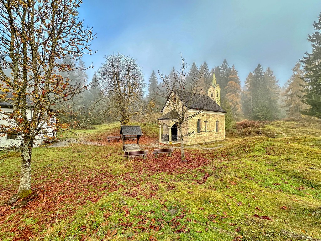 Chapel on Nußlberg mountain in the morning mist in autumn near Kiefersfelden in Bavaria, Germany