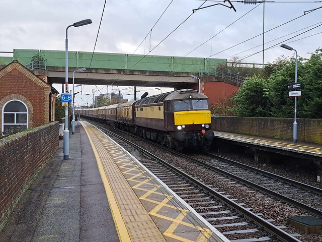 57 601 (Windsor Castle) is passing through Stowmarket Station at speed.