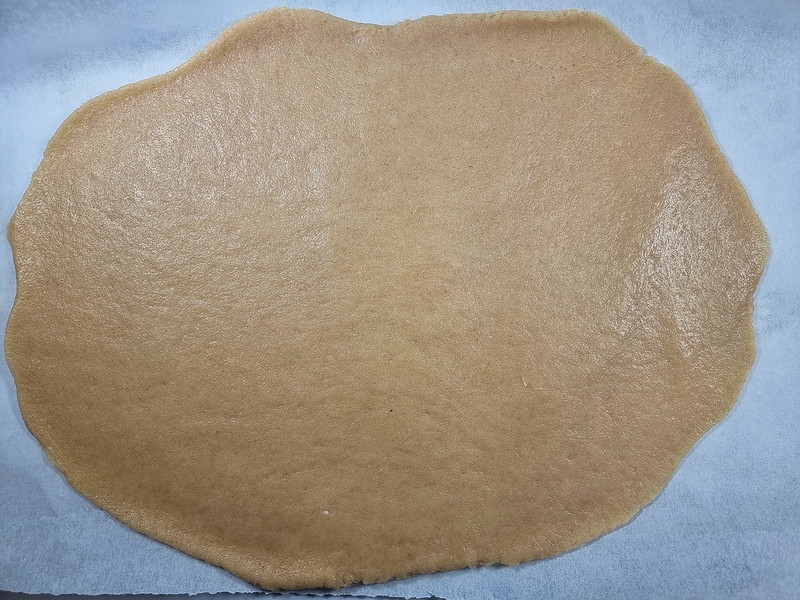 A sheet of the dough rolled thinly on a baking paper