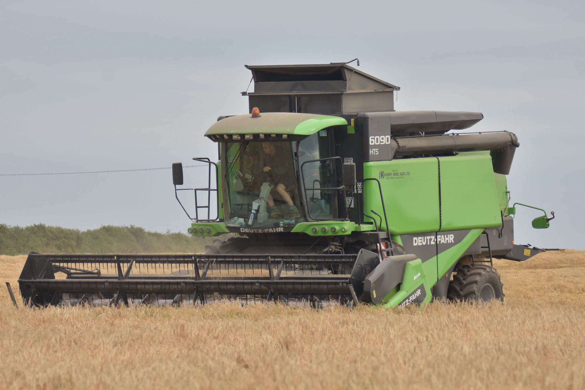 Deutz Fahr 6090 HTS Combine Harvester cutting Spring Barley