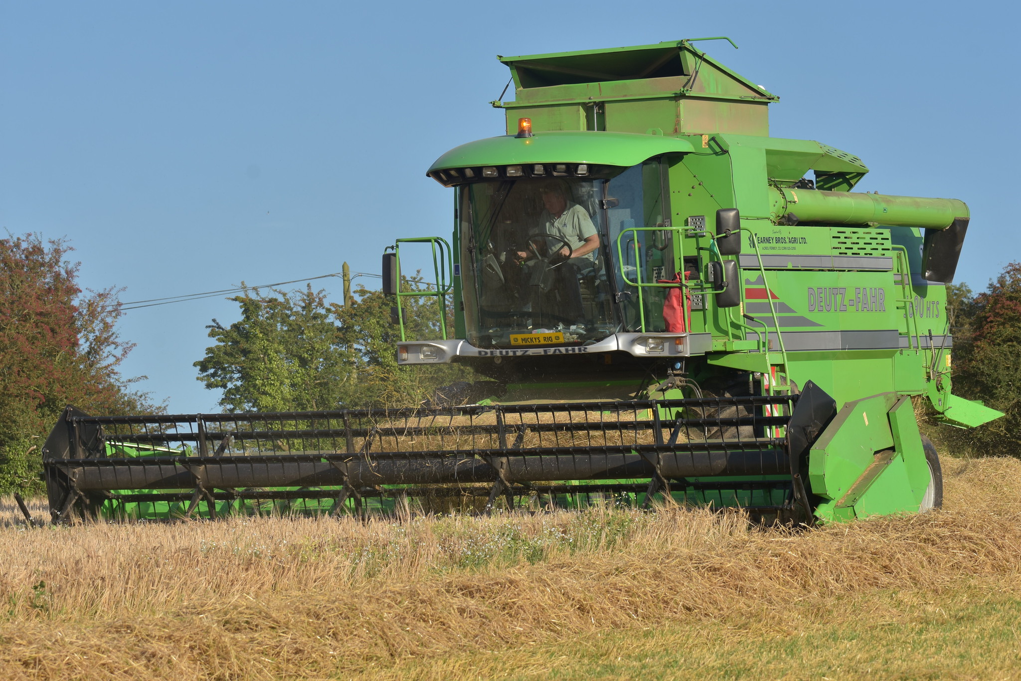 Deutz Fahr 5690 HTS Combine Harvester cutting Spring Barley