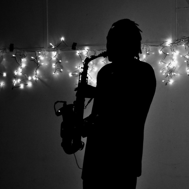 Que Brother Playing His Sax in Black and White