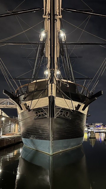 The bow of the USS Constellation, an 1854 Sloop-of-War, by night in Baltimore's Inner Harbor