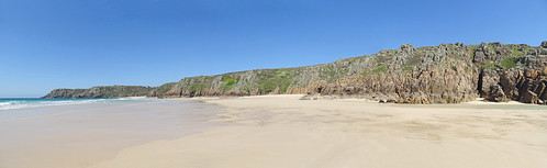 Pedn Vounder Pedn Vounder beach, looking west. In the distance is Porthcurno beach, with the Minack Theatre to the left and the headland of Pedn-men-an-mere (Wireless Point) to the left of that. Owned by the National Trust, Pedn Vounder is an 'official' naturist beach, arguably one of the finest in the country, although Studland in Dorset, Holkham in north Norfolk (another of my favourite beaches) and Morfa Dyffryn in Wales are also rather fine. When the tide is as low as this, it's often possible to walk to Pedn Vounder along the shore from Porthcurno; the more common approach though is via a signed branch off the SW Coastal Path. Be aware though that the final 20m down to the beach is a very steep scramble. As for the beach itself, in common with a lot of the beaches around the Land's End area, it's not really sand, so much as very finely comminuted shell fragments, which do tend to stick to the skin somewhat! A panorama of four images taken close to the Low Water Spring tide on April 20, 2023.