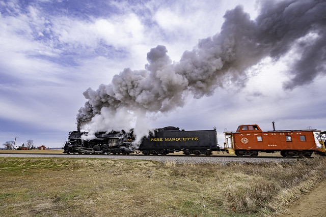 Pere Marquette 1225 crossing E. Gration Rd. in Elsie Michigan on its run to Ashley