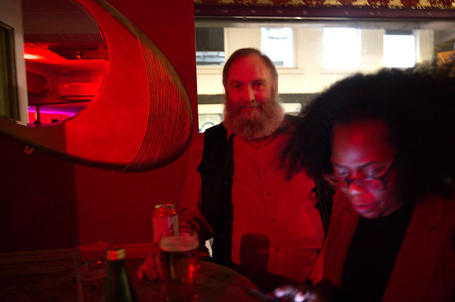 DSC_3898 Justina from Zambia Out on the Town On Her Phone Again and MGS with his Ernest Hemingway Grey Beard at Troy Bar Hoxton Street Shoreditch London. Saturday night I feel the air is getting hot like you baby. It's party time. Photo Credit Alesha