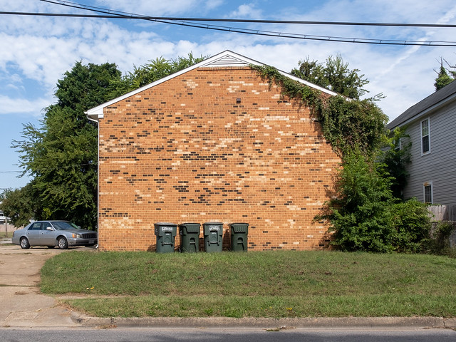 From 1982, a blank wall of brick veneer at the south end of a two-story fourplex in Norfolk, Virginia.