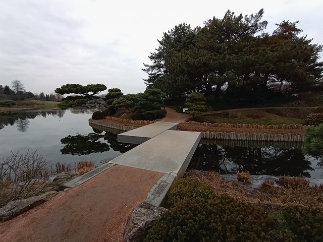 Zig-zag bridge to one of three Japanese garden islands