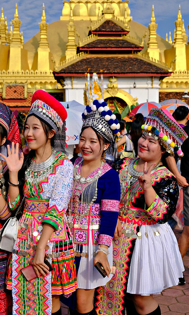 Young Hmong women posing at That Luang, Vientiane