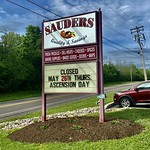 May 25, 2022: Sauder's Is Closed for Ascension Thursday, Seneca Falls, New York The sign outside Sauders Market - a Mennonite-owned grocery in Seneca Falls, New York - alerts drivers along River Road that the store will be closed on May 26 in observance of Ascension Thursday.