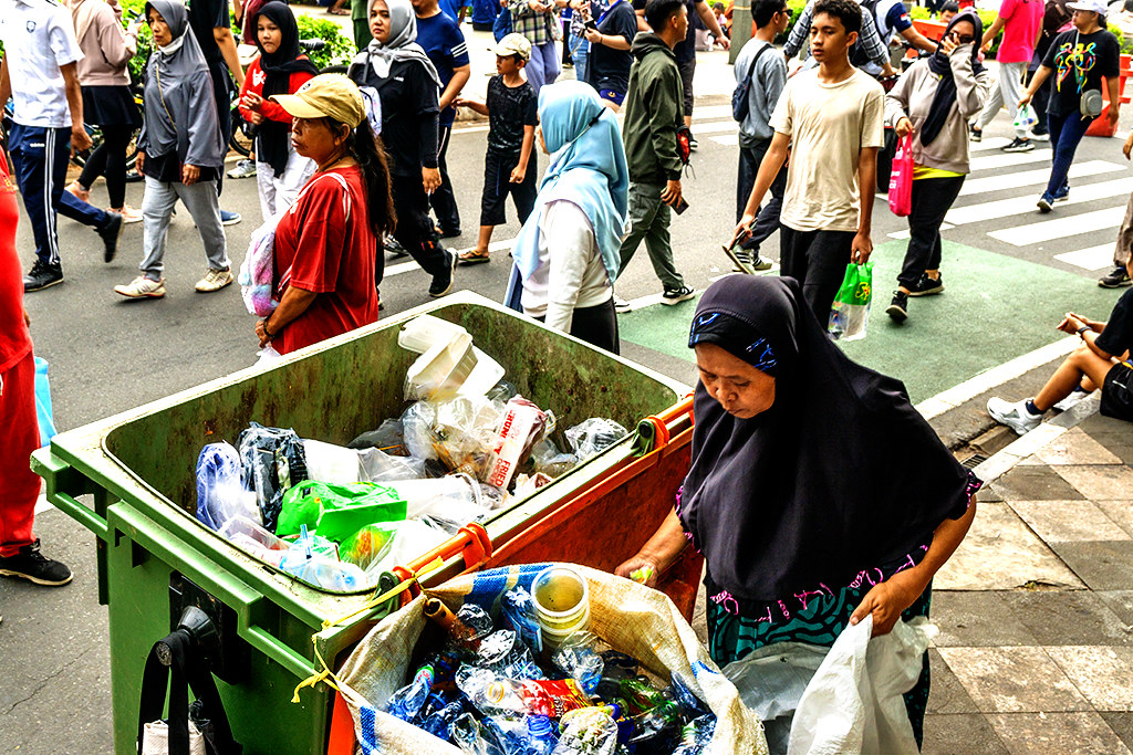 Old woman collecting recyclables on 12-24-23--Jakarta copy