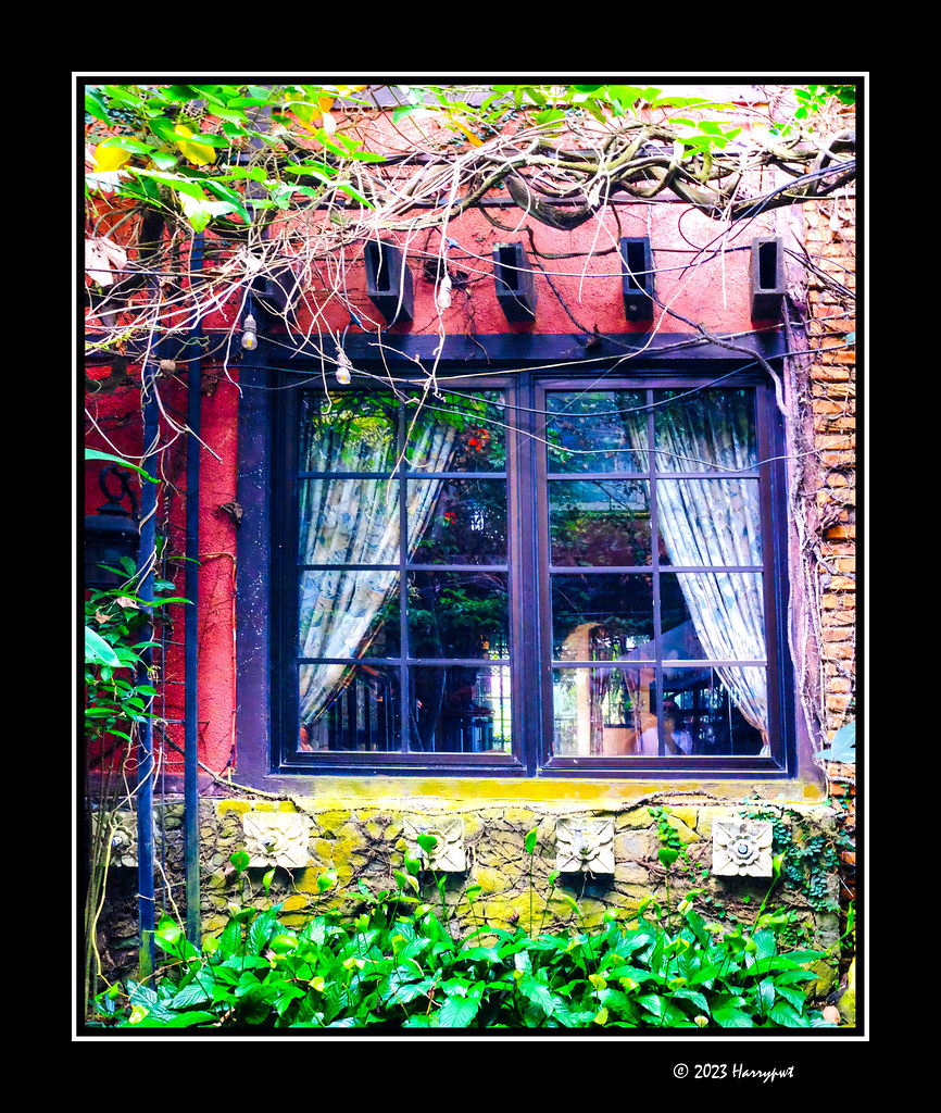 window on red wall