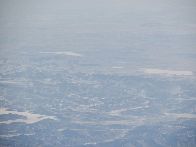 Taken on a Seoul-bound flight, you can faintly make out the Sino-DPRK border cities of Dandong, China and Sinuiju, North Korea. Everything behind the Yalu River is in North Korea (the top quarter of this photo).