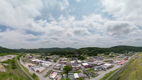 20230525-USDA-RD-WV-LSC-0713 180-degree aerial view of downtown Gassaway, WV, on May 25, 2023.

The new Elk River Trails, part of the Pioneer Trails Network runs through Gassaway. This trail follows a former railway and train station that has now been transformed into an event center with an event field and bandstand. It connects various towns and offers scenic pathways, making it an ideal spot for hikers, bikers, and runners to enjoy the beautiful surroundings.
       The 73-mile Elk River trail winds through Braxton and Clay County, and the 102-mile Elk River Water Trail flows from Sutton to Charleston, WV. These trails are included in the Pioneer Trail Network that connects to the Ohio River. A study stated that for the Elk River Trails, a 4-million dollar investment into the four trail towns of Gassaway, Clay, Sutton, and Clendenin during the next 10 years could result in more than 390 million dollars in economic impact in the region over 15 years. 
The river provides excellent fishing opportunities and is ideal for leisure floating and kayaking. Unlike the whitewater rivers in West Virginia, this river is family-friendly and can be safely navigated by users of all ages and abilities. Nicholas and Webster counties are both working on enhancing their recreation amenities and improving connectivity to Snowshoe Resort to take advantage of an established recreation hub. Every county or community has the opportunity to create recreation-related businesses such as rental shops, restaurants, and commercial and lodging establishments and to showcase local artisans, musicians, and unique town history. 
This project aims to provide infrastructure and support services for community and economic development in all trail town communities within the Pioneer Network. The goal is to develop trail towns in the Pioneer Network region by leveraging the state&#039;s thriving tourism industry. The approach will be comprehensive and regional, with an emphasis on distressed counties. It will include infrastructure development, facility construction, and ancillary activities necessary to create prosperous and thriving communities. The strategies used will address various needs identified by communities and can involve county, state, and federal entities.
The strategy builds on the success of Advantage Valley&#039;s FASTER WV initiative to facilitate the start-up and expansion of businesses with:
1.Develop marketing materials to recruit Elk River Trails entrepreneurs and support existing businesses. 
2.Place business outreach ambassadors in Braxton and Clay Counties to recruit and link entrepreneurs to FASTER WV and other resources.
3.Provide coaching and technical assistance awards to help entrepreneurs&#039; start-up efforts. These awards can support training, marketing, and other essential aspects of starting a business.
4.Implement community improvement projects to make the trail towns more attractive for tourists. 
5.Implement a faÃ§ade renovation grant program for &amp;quot;Main Street&amp;quot; businesses.


Their strategy is supported by the U.S. Department of Agriculture (USDA), Rural Development (RD), Rural Partners Network (RPN) SMART project approach. This approach has four key strategies, namely: 
1. Building on each region&#039;s competitive advantage and leveraging the marketplace 
2. Establishing and maintaining a robust regional infrastructure 
3. Creating revitalized, healthy, and resilient communities 
4. Developing talented and innovative people.

-----

RPN
The Rural Partners Network (RPN) is a government program that aims to assist rural communities in finding resources and funding to create job opportunities, build infrastructure, and support long-term economic stability. This network comprises federal agencies and commissions that work directly with rural communities to enhance their prosperity through job creation, infrastructure development, and community improvement. Led by USDA Rural Development, members of the RPN collaborate to identify resources to help rural people build the futures they envision for the unique places they call home.

RPN deploys federal staff to selected RPN Community Networks located across the United States. These RPN Liaisons collaborate with small, rural communities to understand their needs and the importance of leveraging the programs and resources of various funders and assistance providers to achieve their goals. The Liaisons provide assistance to local individuals in navigating programs, building relationships, and identifying community-driven solutions.

Participating RPN agencies and offices (rural.gov/about#block-views-block-partners-partners-listing) are also joining forces to promote rural priorities as federal programs and policies are developed to address funding gaps, increase access to technical assistance and ensure equitable access to federal funding.

For more information, please go to RURAL.gov, the official website of the Rural Partners Network.

Courtesy Media by Lance Cheung.