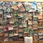 Paper money collection at Pivnice U Kata in Prague, Czechia 