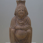 Roman ceramic pitcher in the form of an old woman clutching a lagynos Roman Imperial Period, late 1st-early 3rd c. CE
From Turkey, Knidos (see &lt;i&gt;Cnidus&lt;/i&gt; on &lt;a href=&quot;https://pleiades.stoa.org/places/599575&quot; rel=&quot;noreferrer nofollow&quot;&gt;Pleiades&lt;/a&gt;)

In the collection of, and photographed on display at, the University of Missouri Museum of Art and Archaeology, Columbia, Missouri, USA
At the time the museum was located at Mizzou North
Inv. 2000.15 (Weinberg Fund)
&lt;a href=&quot;https://maacollections.missouri.edu/ArgusNET/Portal.aspx?lang=en-US&amp;amp;g_AAEM=2000.15&amp;amp;d=d&quot; rel=&quot;noreferrer nofollow&quot;&gt;maacollections.missouri.edu/ArgusNET/Portal.aspx?lang=en-...&lt;/a&gt;