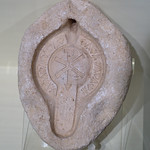 Upper valve of a lamp mold in stucco, with Chi-Rho motif Roman Late Imperial Period, Byzantine period, ca. 5th c. CE
From Tunisia

In the collection of, and photographed on display at, the University of Missouri Museum of Art and Archaeology, Columbia, Missouri, USA
At the time the museum was located at Mizzou North
Inv. 75.54
&lt;a href=&quot;https://maacollections.missouri.edu/ArgusNET/Portal.aspx?lang=en-US&amp;amp;g_AAEM=75.54&amp;amp;d=d&quot; rel=&quot;noreferrer nofollow&quot;&gt;maacollections.missouri.edu/ArgusNET/Portal.aspx?lang=en-...&lt;/a&gt;