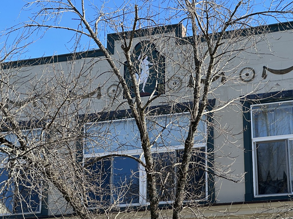 Insignia on Montgomery Ward Building. Central Avenue. Dover, New Hampshire.