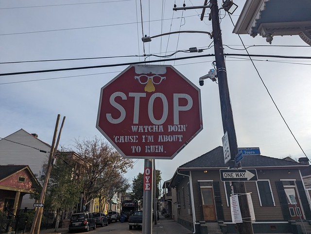 STOP WHATCHA DOIN CAUSE I'M ABOUT TO RUIN, defaced stop sign, Frenchman Street, New Orleans, Louisiana, USA