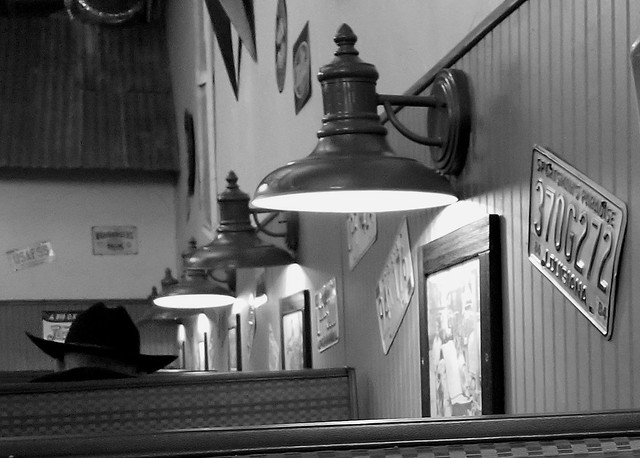 Americana: Man with a black cowboy hat in an old diner