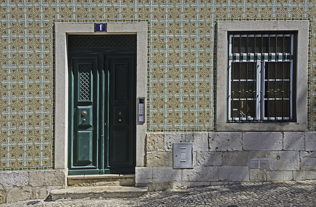 Tile Façade, Green Door, and Barred Window
